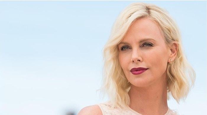 charlize-theron-brings-back-classic-style-in-all-white-black-outfit-at-baby2baby-gala