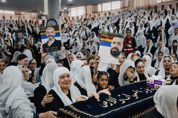 amid-sectarian-violence-in-a-syrian-city,-even-the-funerals-are-armed